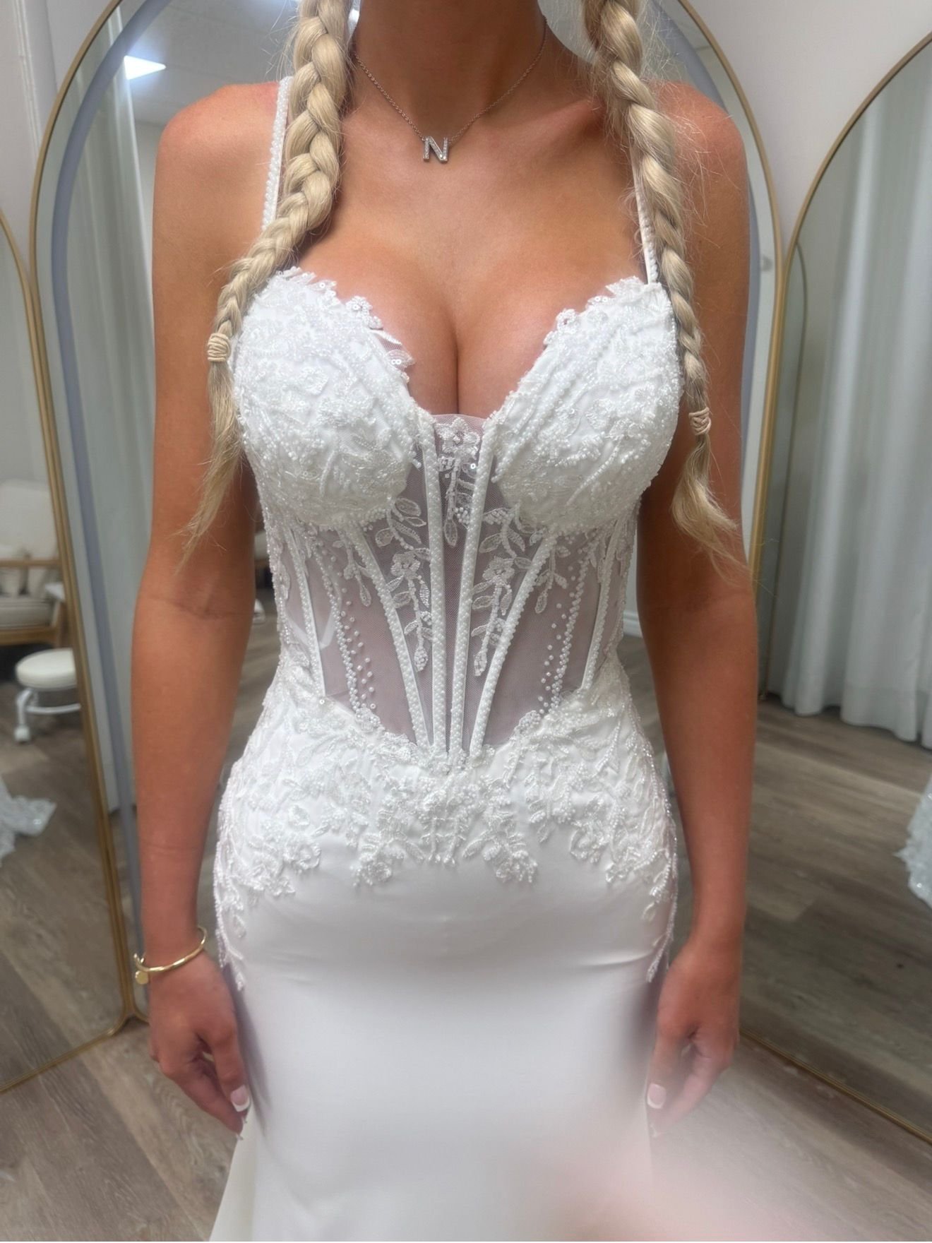 Close-up of a beaded lace corset bodice on a fitted bridal gown at Kaivy Alteration Studio