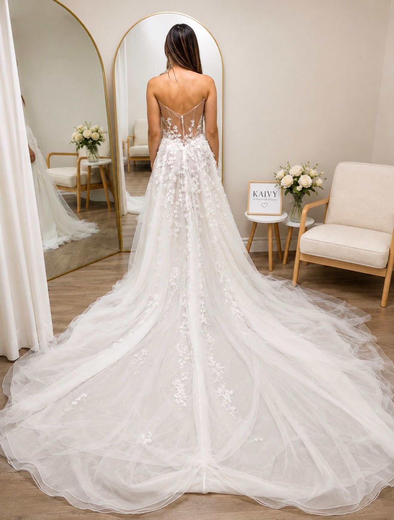 Bride in a wedding gown with a long train inside Kaivy Alteration Studio