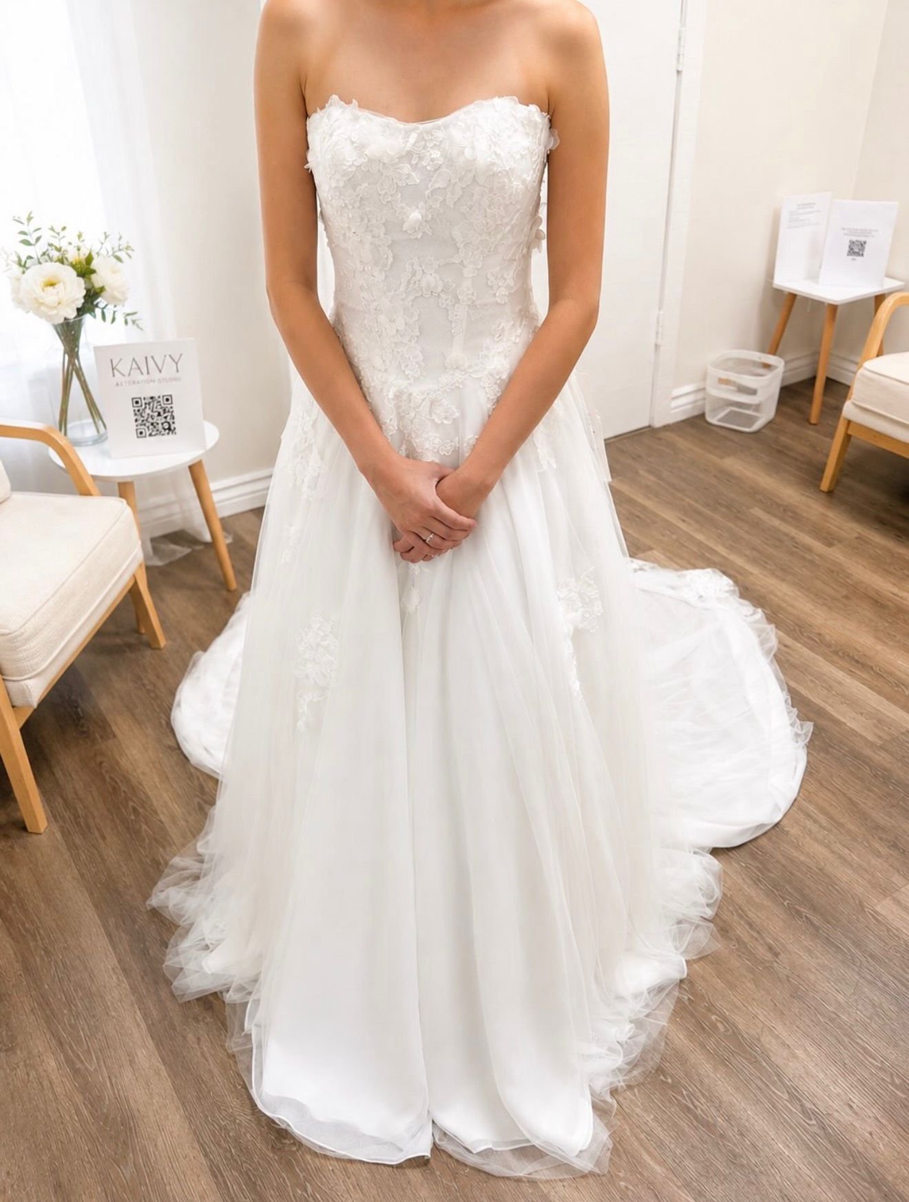 Bride wearing a strapless lace A-line wedding gown fitted at Kaivy Alteration Studio